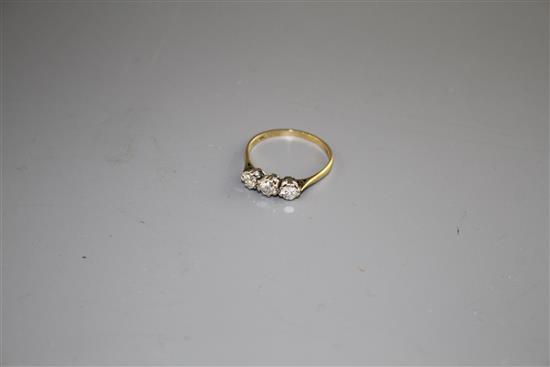 An 18ct and Plat, three stone diamond ring, size P, gross weight 1.8 grams,